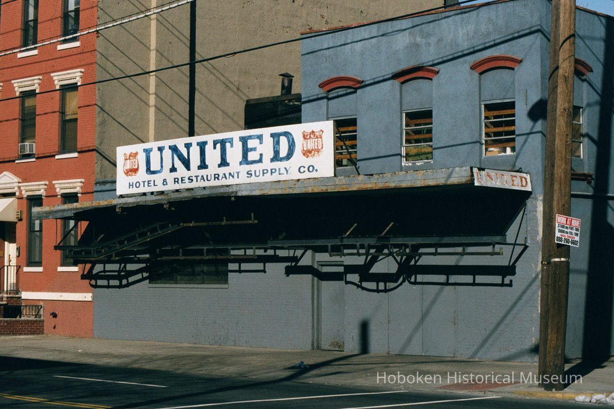 Three color photos of signs for United Hotel & Restaurant Supply Co., 550 Observer Highway, Hoboken, Jan. 3 & 4, 2002. picture number 1