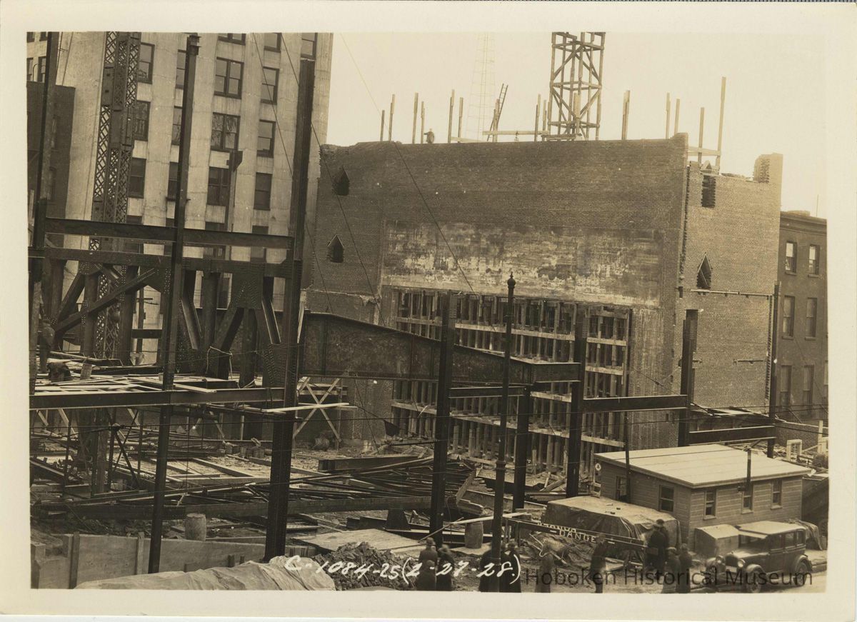 Sepia-tone photo of steel frame erection & fireproof stage house for the Fabian Theatre, Newark & Washington Sts., Hoboken, Feb. 27, 1928. picture number 1