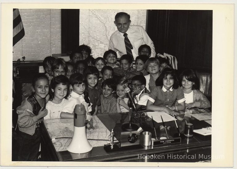 Mayor Tom Vezzetti in his office with schoolchildren