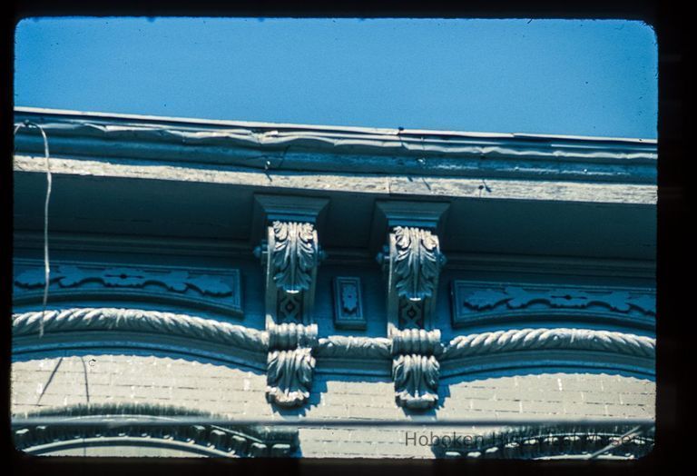 Color slide of detail view of cornice, brackets, frieze and window heads at an unidentified building on the corner of 2nd and Jackson picture number 1