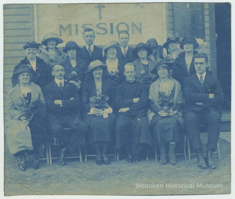 Cyanotype print of a group of men and women seated outside a church or mission building, no place [Hoboken], no date, ca. 1900-1910. picture number 1