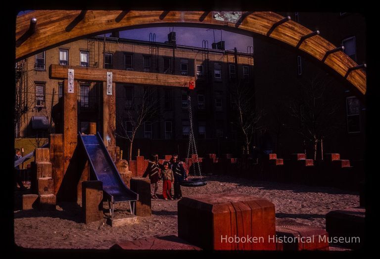 Color slide of eye-level view of children on a playground on the east side of Willow between 12th & 13th picture number 1