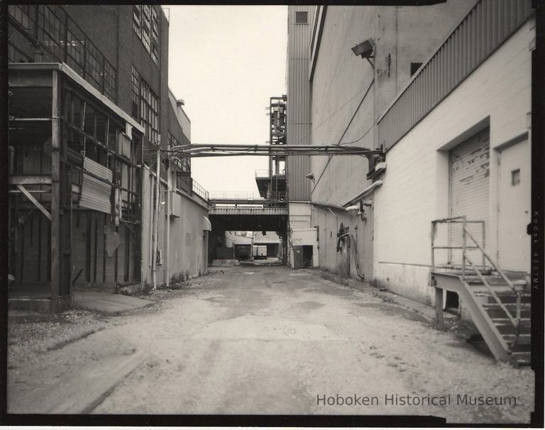 B+W photo of former Maxwell House Coffee plant exterior, looking north between Extraction Building & Storage Silos, Hoboken, 2003. picture number 1