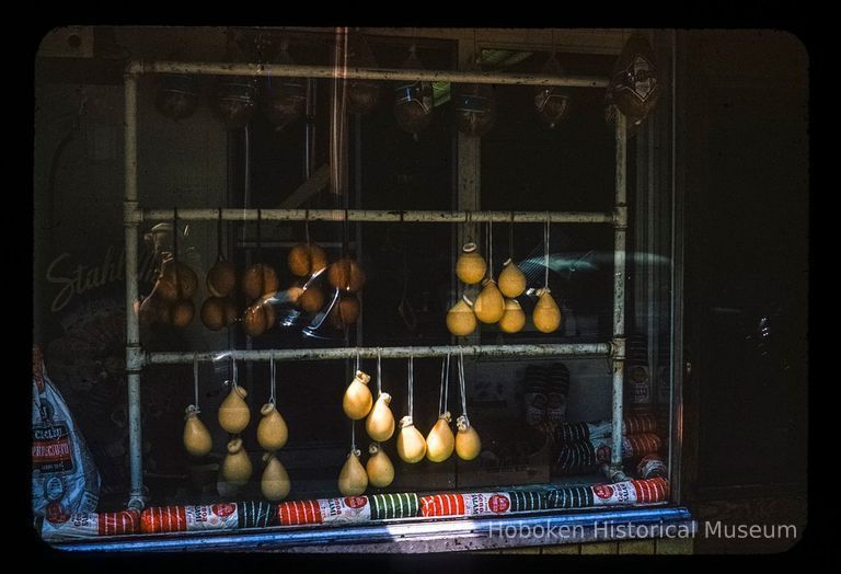 Uncropped image of Italian cheese in window.