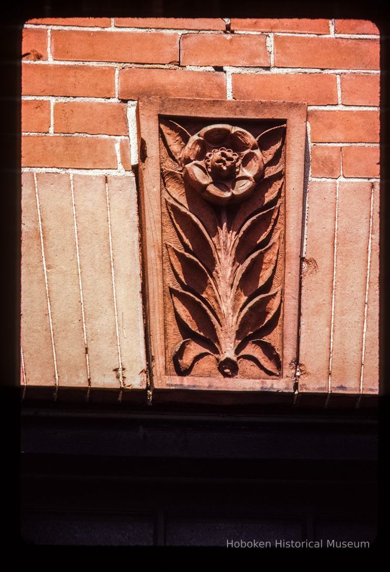 Color slide of close-up view of keystone and flat arch on one of the buildings between 206 and 218 13th on the N side between Park and Garden picture number 1