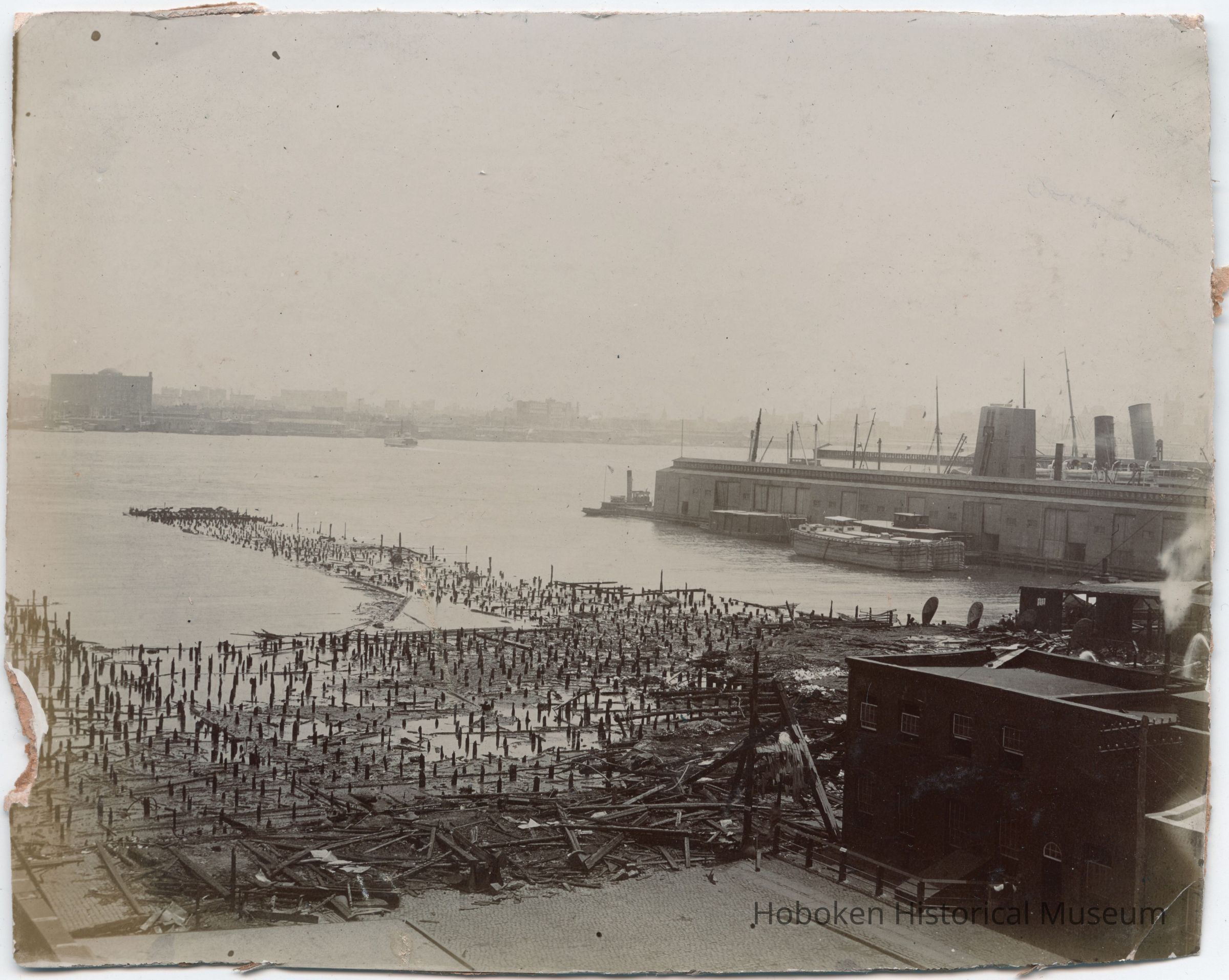 Sepia-tone photo of piers destroyed in June 1900 pier fire, Hoboken. picture number 1