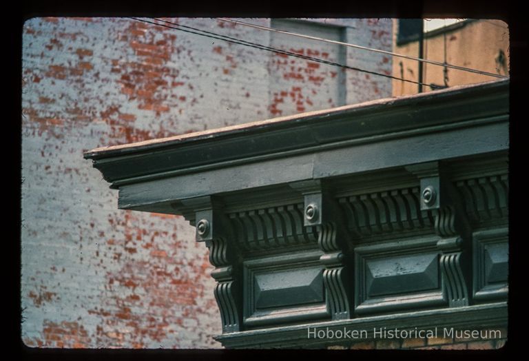 Color slide of detail view of cornice and brackets on a building on Bloomfield and 9th picture number 1