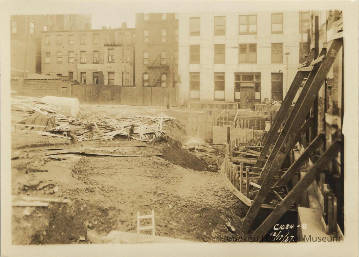 Sepia-tone photo of foundation preparation and concrete forms on the south end of the site for the Fabian Theatre, Hoboken, Dec. 17, 1927. picture number 1