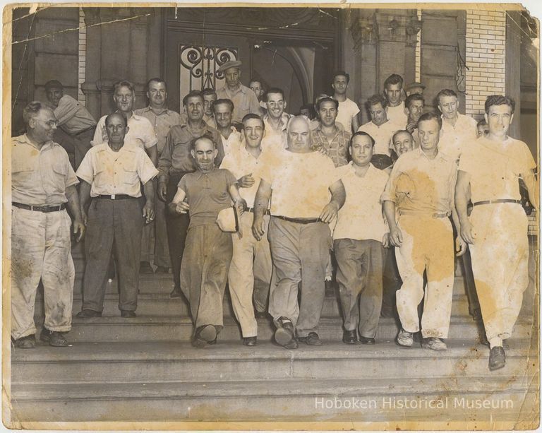 B+W photo of men on stairs exiting a building, Hoboken, no date, circa 1945-1950. picture number 1