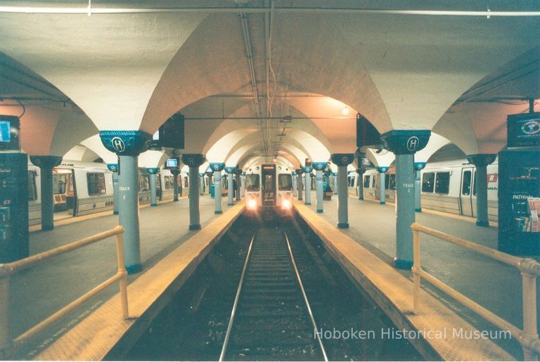 Digital image of color photo looking down track 2 of an arriving train taken from the east end of the Hoboken PATH station, Nov., 1999. picture number 1