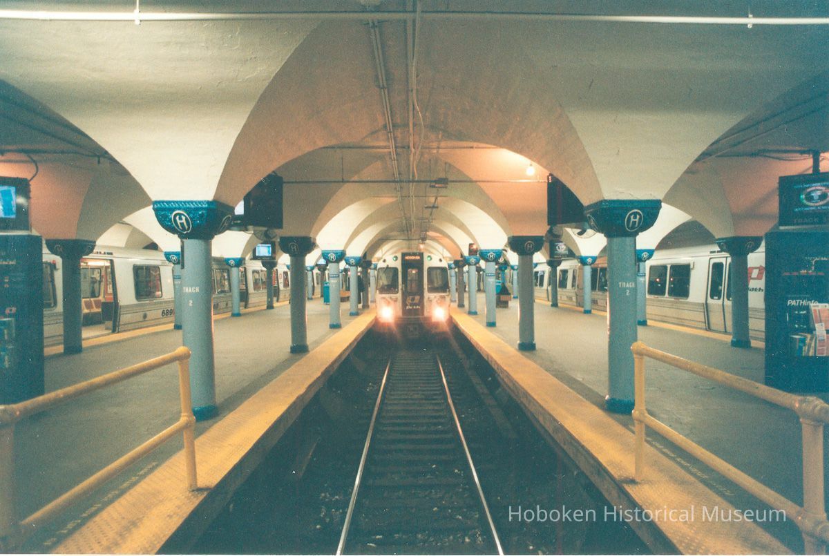 Digital image of color photo looking down track 2 of an arriving train taken from the east end of the Hoboken PATH station, Nov., 1999. picture number 1