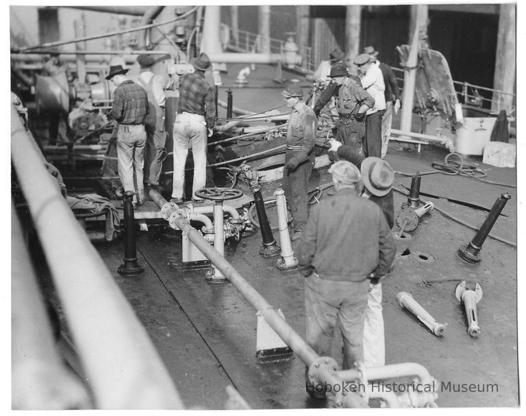 B+W photo of workers repairing main deck of unknown ship, Hoboken, no date, ca. 1940. picture number 1