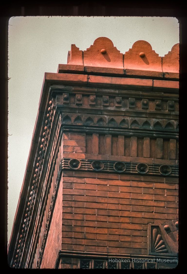 Color slide of detail view of parapet, brick cornice and friezes at 800 Hudson on the NW corner with 8th picture number 1