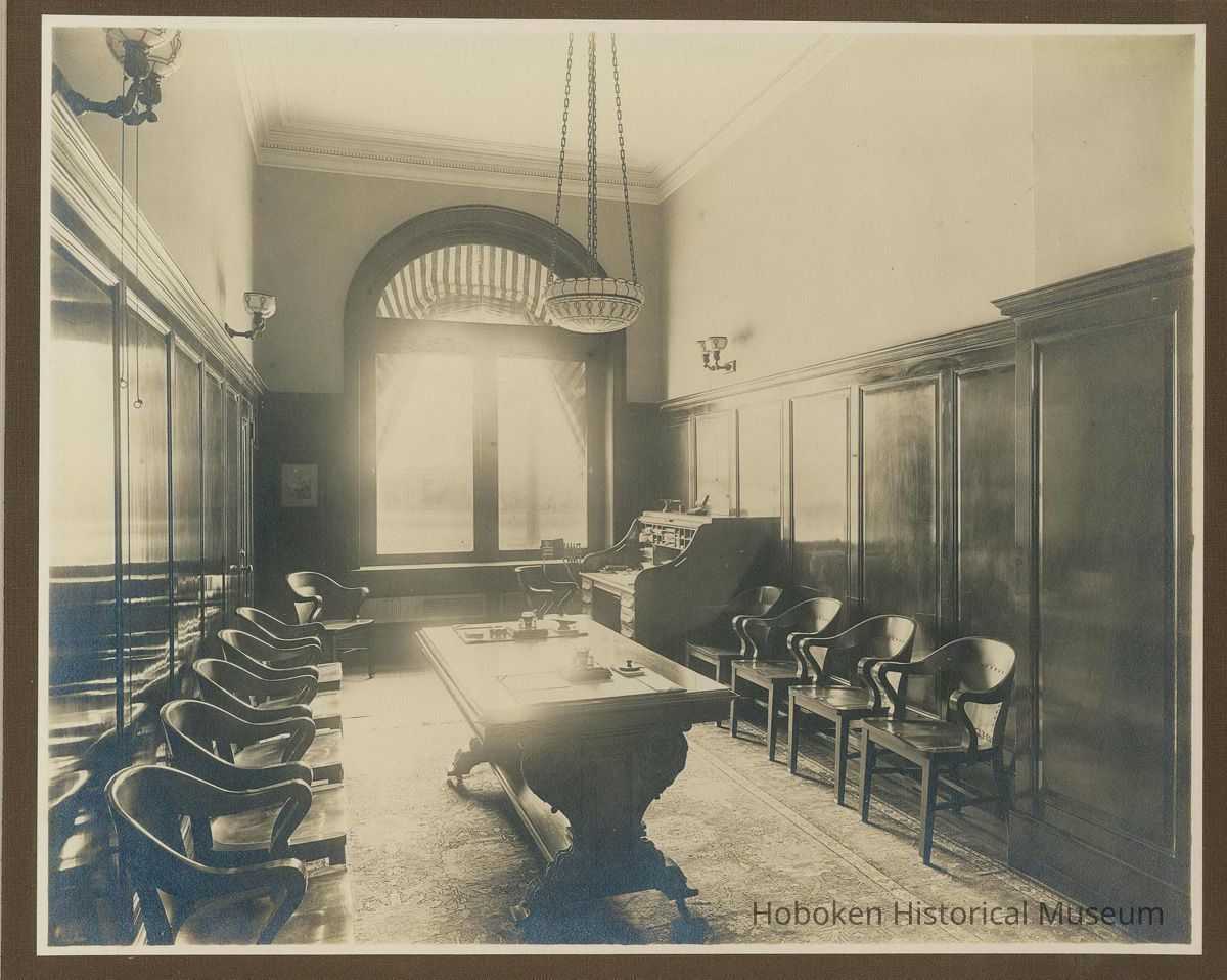 Sepia-tone photo of an office or waiting room of the Hoboken Bank for Savings, Hoboken, no date, ca. 1890. picture number 1