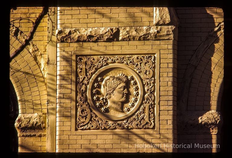 Color slide of close-up view of decorative tile on the side façade of the Columbia Club at 1101 Bloomfield on the corner of 11th and Bloomfield picture number 1