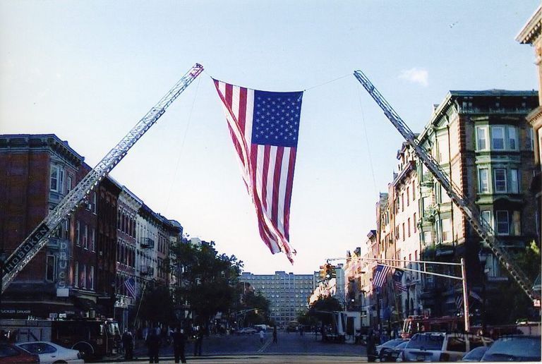 Tenth and Washington, Veterans Day Parade; flag, ladder firetrucks