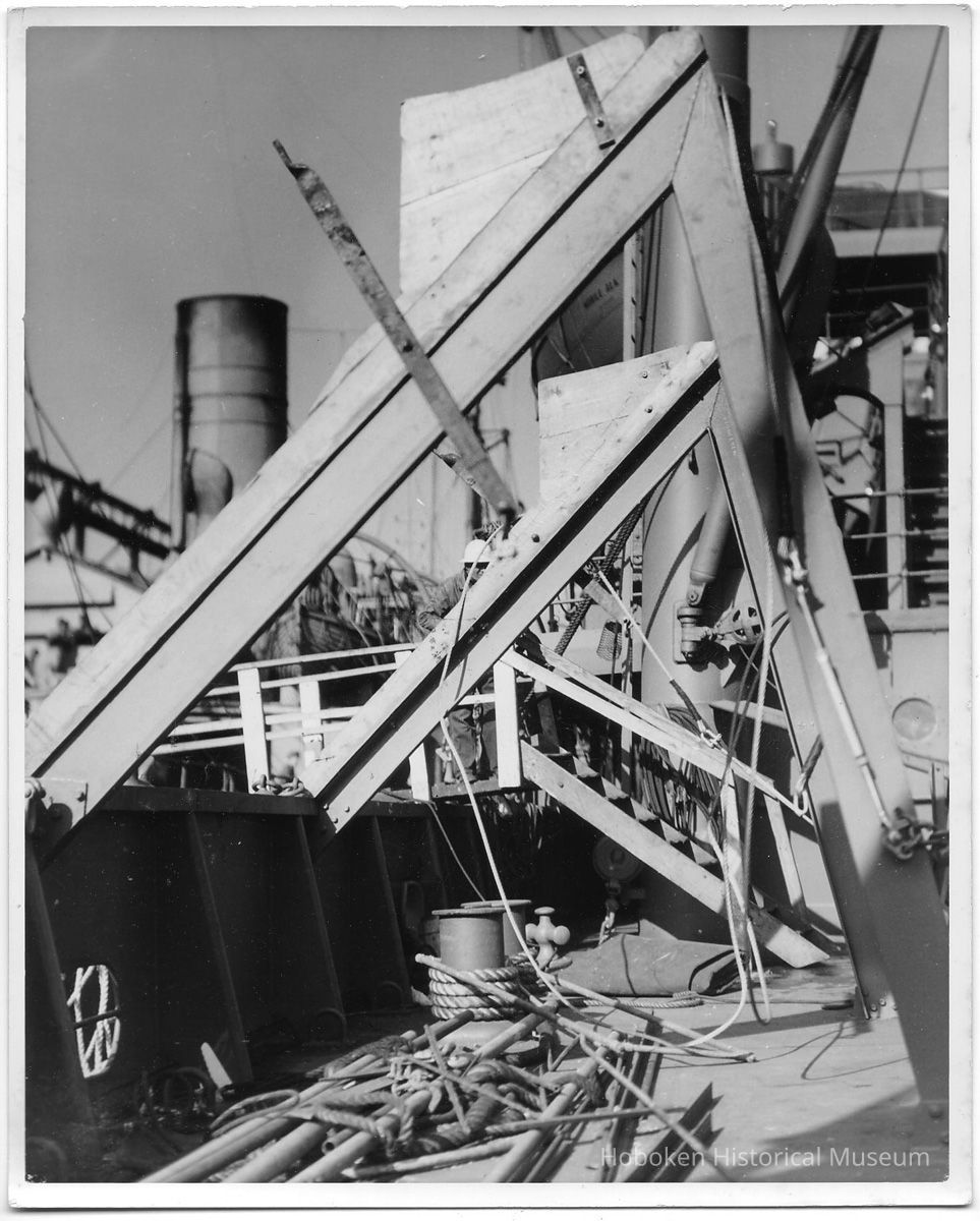 B+W photo of a workman on a damaged upper deck, Hoboken, no date, ca. 1940. picture number 1