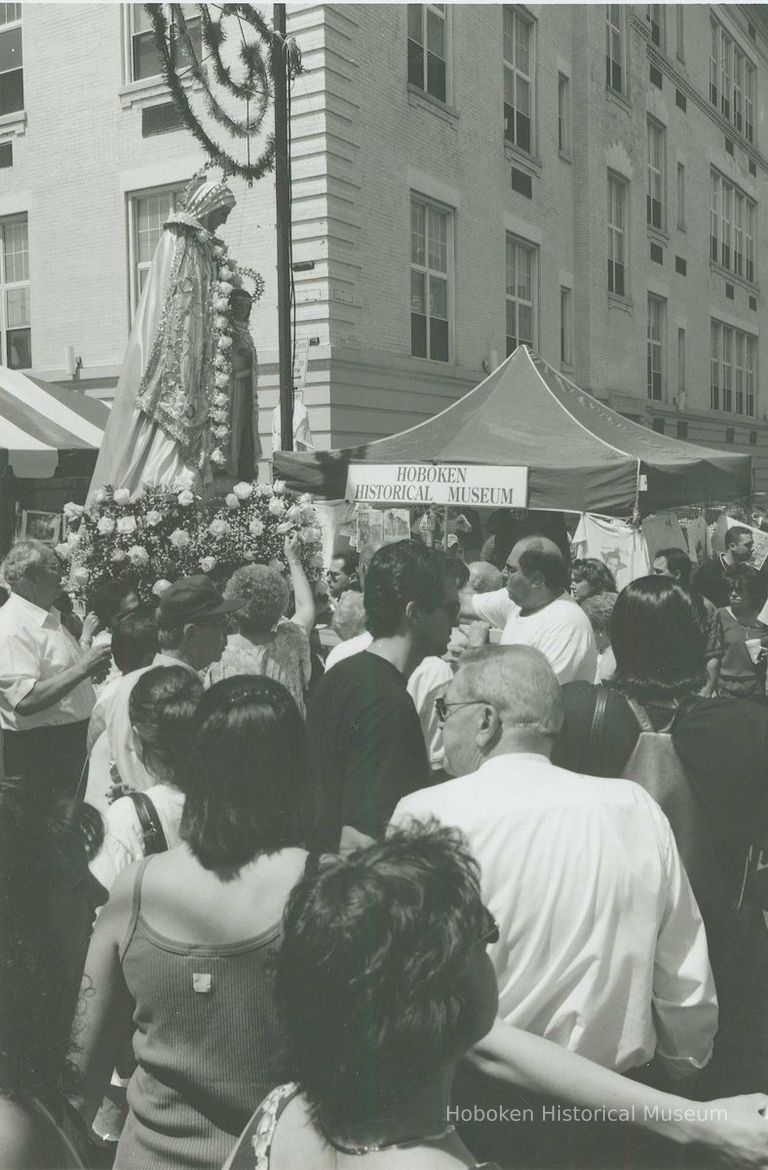 B+W photo of the St. Ann's Feast procession of the Madonna passing the Hoboken Historical Museum's booth, Hoboken, July, 2000. picture number 1