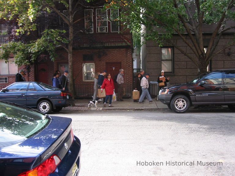 Digital copy of color photo of food tour members walking to a tour stop, Hoboken, Oct. 18, 2003. picture number 1