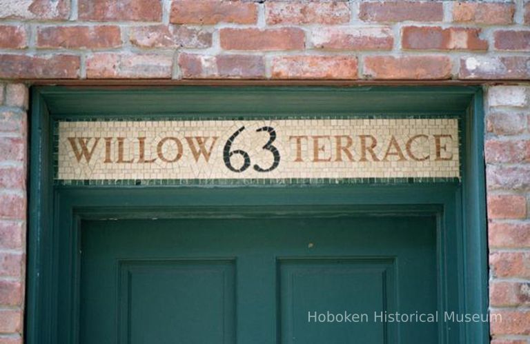 Color photo detail of the tiled address sign over the main entrance to 63 Willow Terrace, Hoboken, Sept., 1-5, 2001. picture number 1