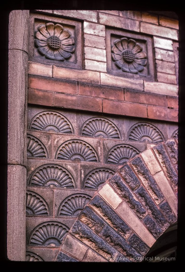 Color slide of detail view of portico semicircular arch and decorative tiles at 105 4th between Washington and Bloomfield picture number 1