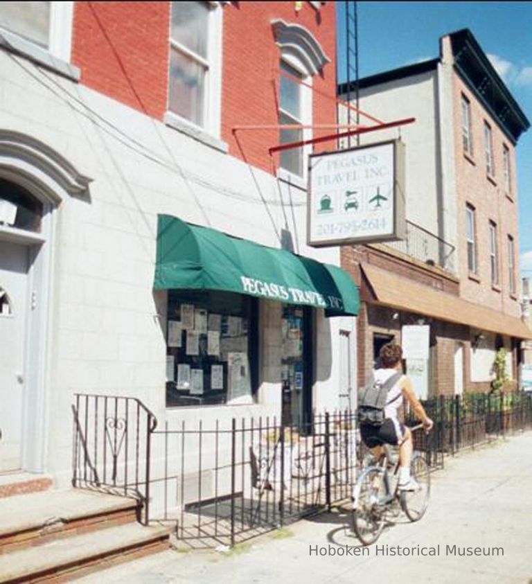 Color photo of signs for Pegasus Travel Inc. at 254 Sixth St. Hoboken, Sept., 1-5, 2001. picture number 1