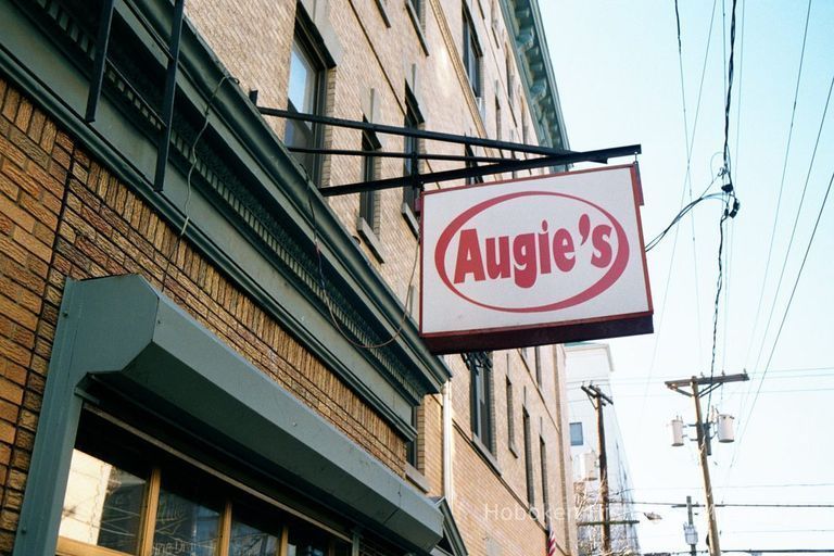 Color photo of hanging sign for Augie's Wine & Liquors, 461 Fifth St., Hoboken, Jan. 3 & 4, 2002. picture number 1