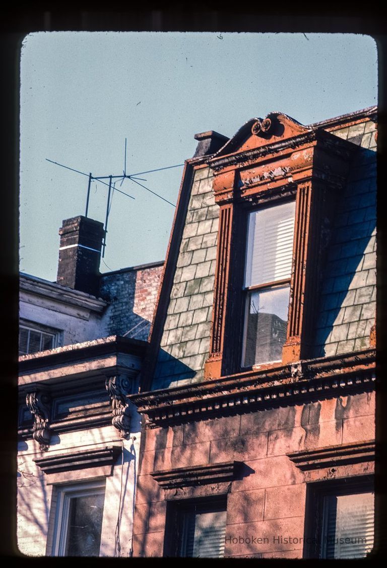 Color slide of detail view of mansard roof, gable dormer, cornice, dentils and window heads at 158 10th between Bloomfield and Garden picture number 1