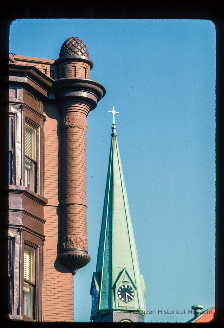 Color slide of detail view of turret and bay window at 801 Washington on the NE corner of Washington and 8th and the steeple of St. Matthew Trinity Lutheran church on the SE corner of 8th and Hudson picture number 1