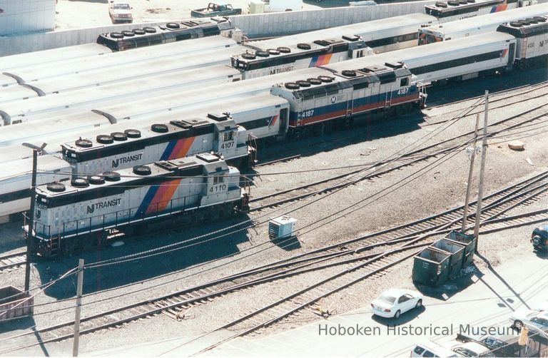 Digital image of color photo of an aerial view of New Jersey Transit passenger trains locomotives in the yard, Hoboken Terminal, Hoboken, Sept. 2002. picture number 1