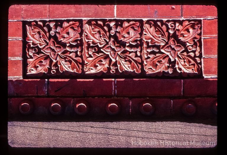 Color slide of close up-view of decorative tile on one of the buildings between 725 and 731 Washington between 7th and 8th picture number 1