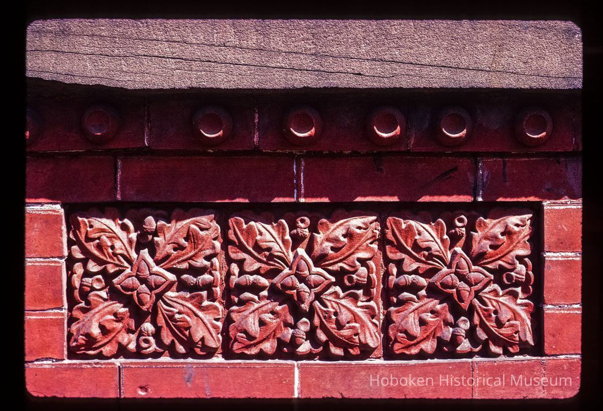 Color slide of close up-view of decorative tile on one of the buildings between 725 and 731 Washington between 7th and 8th picture number 1