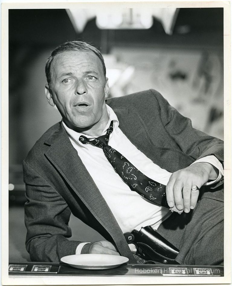 1: Sinatra reclining on elbow