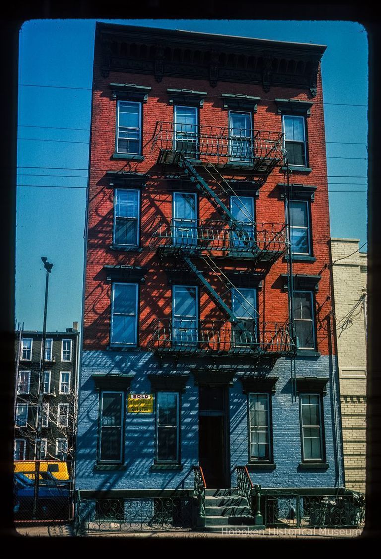 Color slide of eye-level view of façade and fire escape of unidentified address on Jackson between 1st & 2nd picture number 1