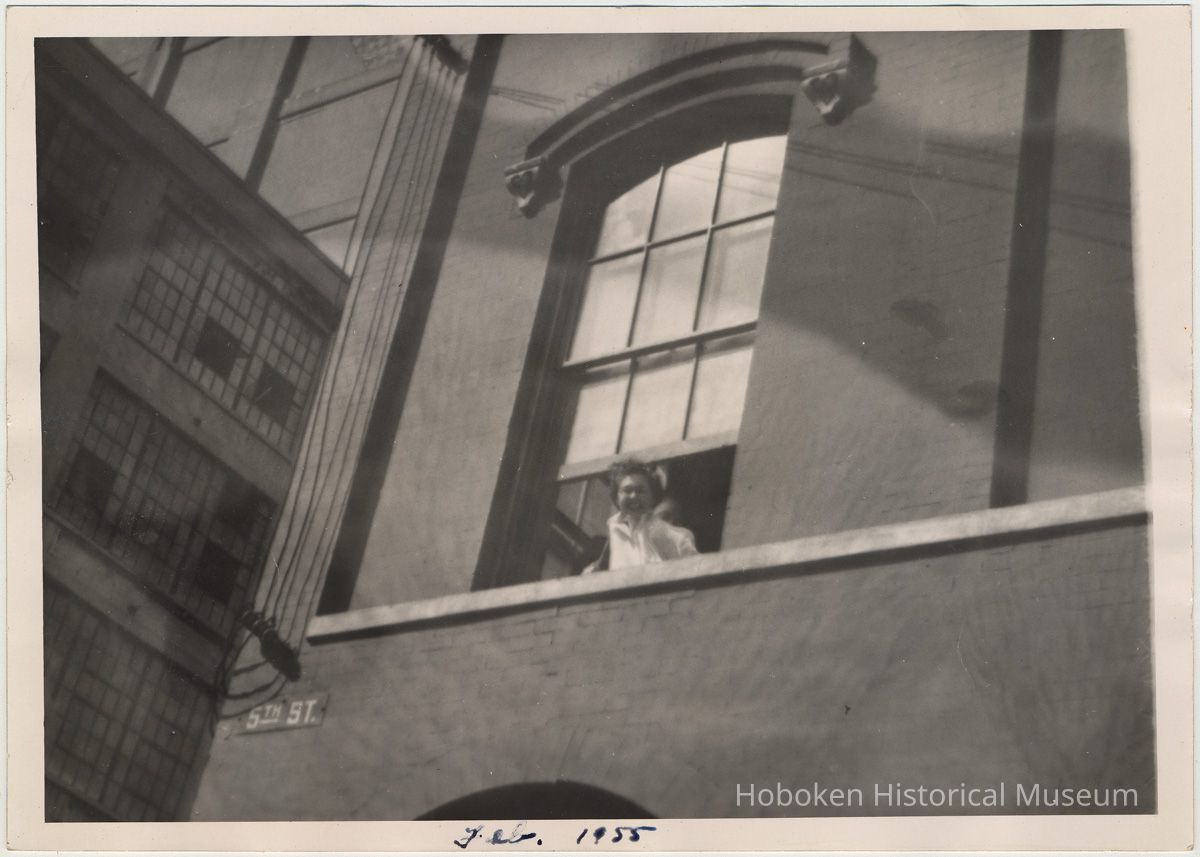 Digital image of B+W photo of Paul Millenthal leaning out a second story window, Stevens Hoboken Academy, Hoboken, February, 1955. picture number 1