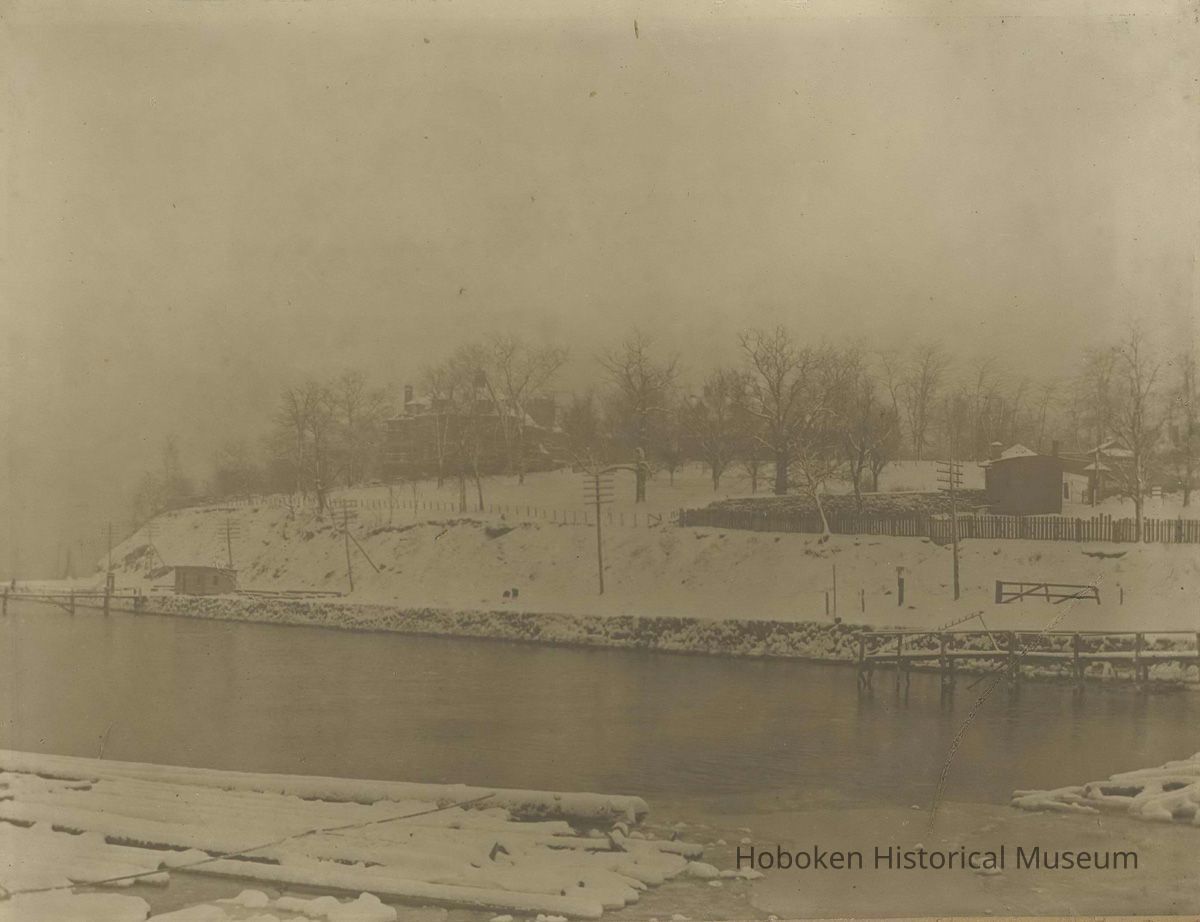 Sepia-tone photo of Stevens Castle and River Walk in winter looking southeast, Hoboken, no date, ca. 1890. picture number 1