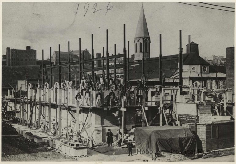 B+W photo of construction progress on St. Ann's Church showing erection of the steel frame and masonry work, Hoboken, 1926. picture number 1