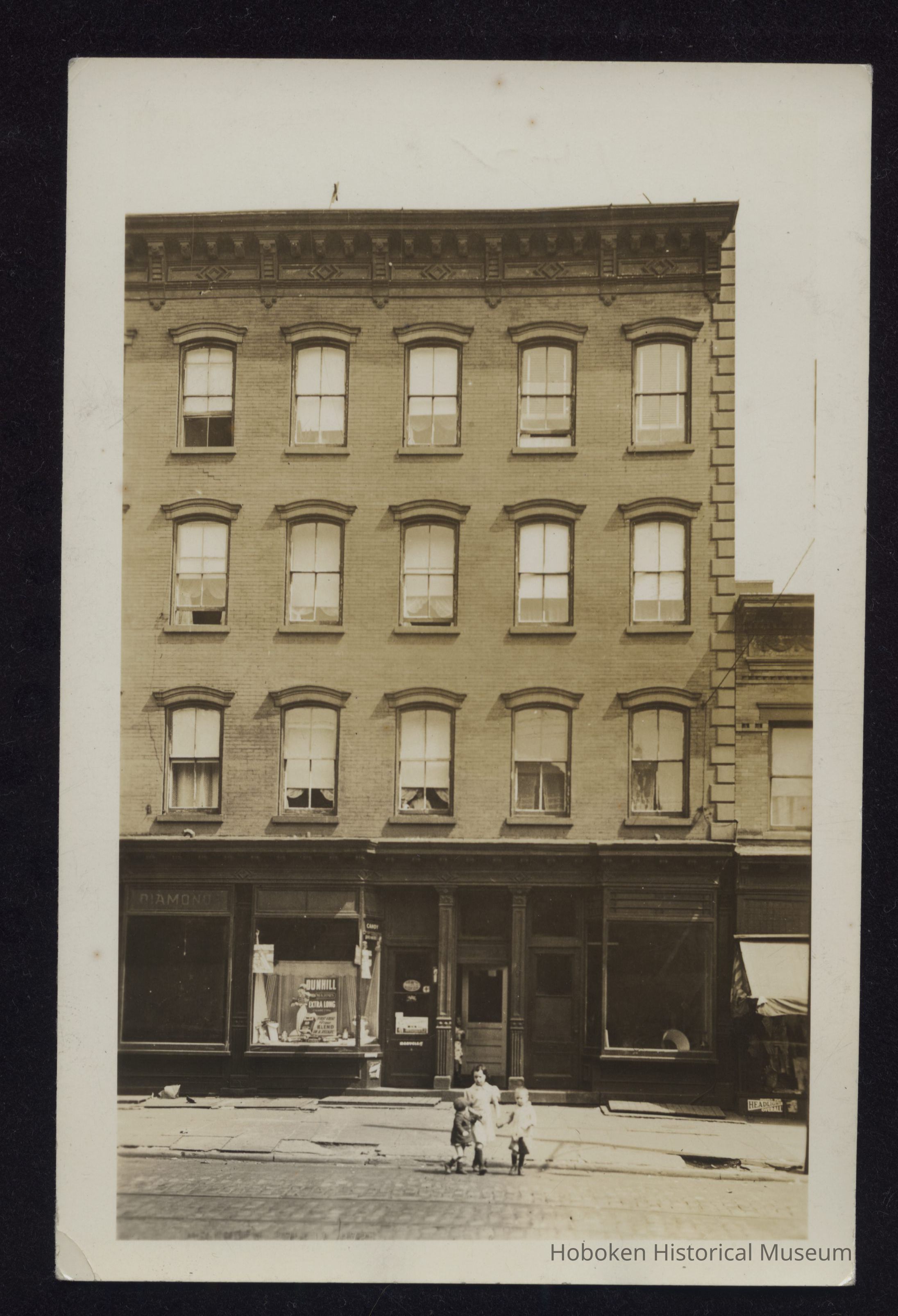 B&W photo of mixed-use row house apartment building at unknown location in New Jersey. picture number 1