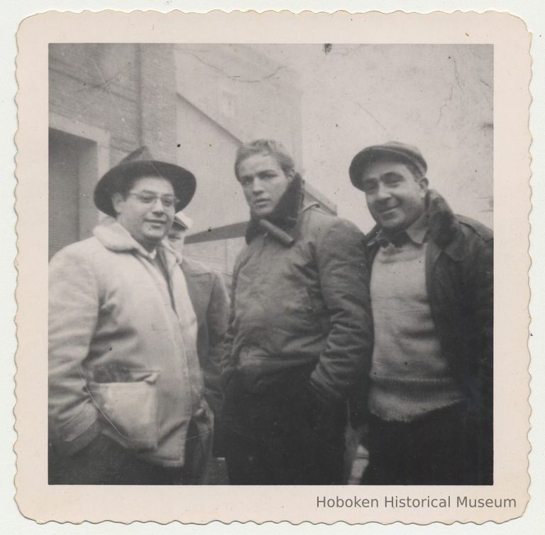 Black-and-white photo of Marlon Brando with Joey Lisa (left) & 