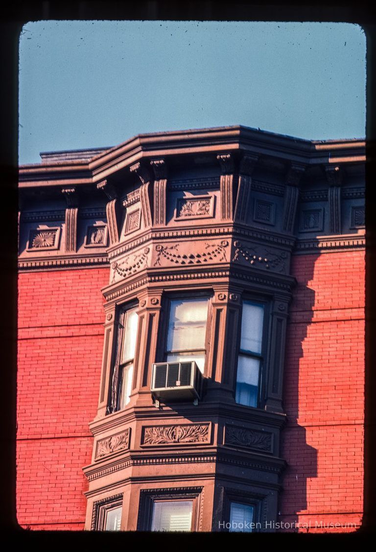 Color slide of detail view of cornice and bay windows at a building on 11th between Bloomfield and Garden picture number 1