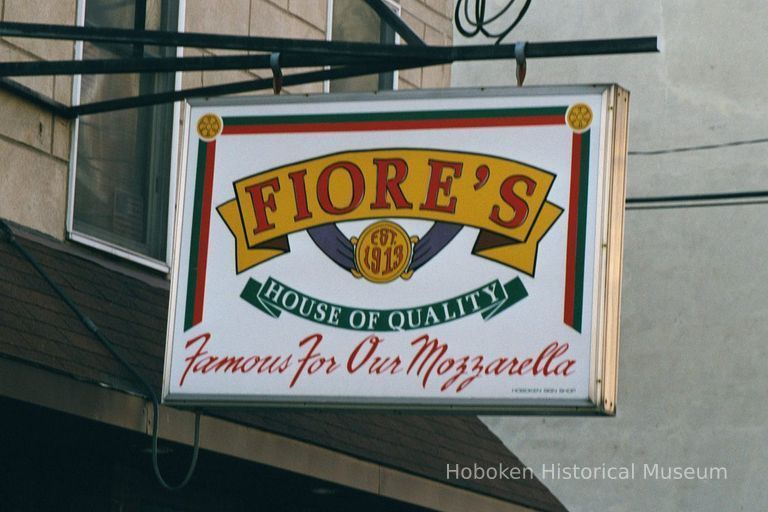 Color photo of hanging sign for Fiore's House of Quality, Famous for our Mozzarella, 414 Adams St., Hoboken, Jan. 3 & 4, 2002. picture number 1