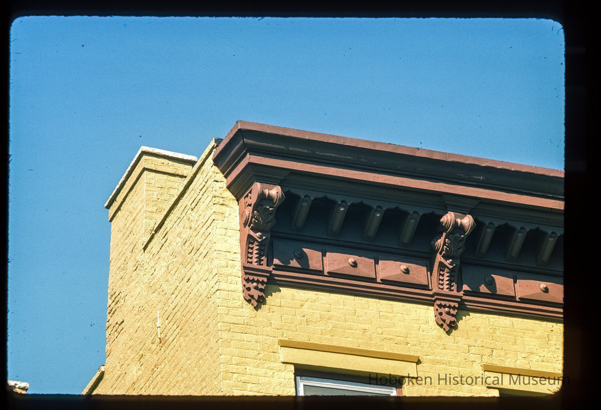 Color slide of close-up view of cornices, brackets, friezes, chimney and window heads on a building at an unidentified location picture number 1