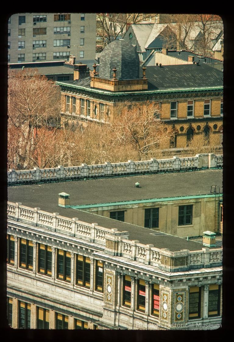 Color slide of aerial view of the Hoboken Public Library rooftop at 500 Park in the background and the A.J. Demarest Junior High (Hoboken Middle School) rooftop at 158 4th in the foreground picture number 1