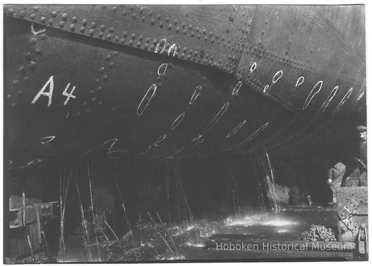 B+W photo of the keel of an unknown ship in dry dock with markings for repair, Hoboken, no date, ca 1940. picture number 1