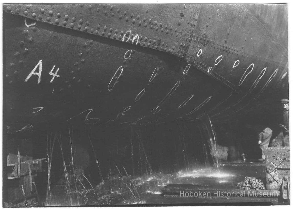 B+W photo of the keel of an unknown ship in dry dock with markings for repair, Hoboken, no date, ca 1940. picture number 1