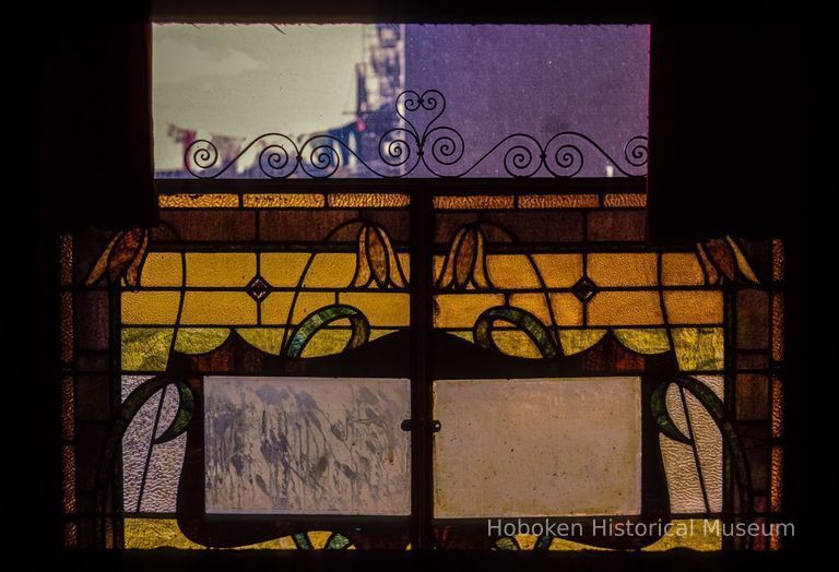 Color slide of interior view of light through a stained glass window at 14th and Garden picture number 1