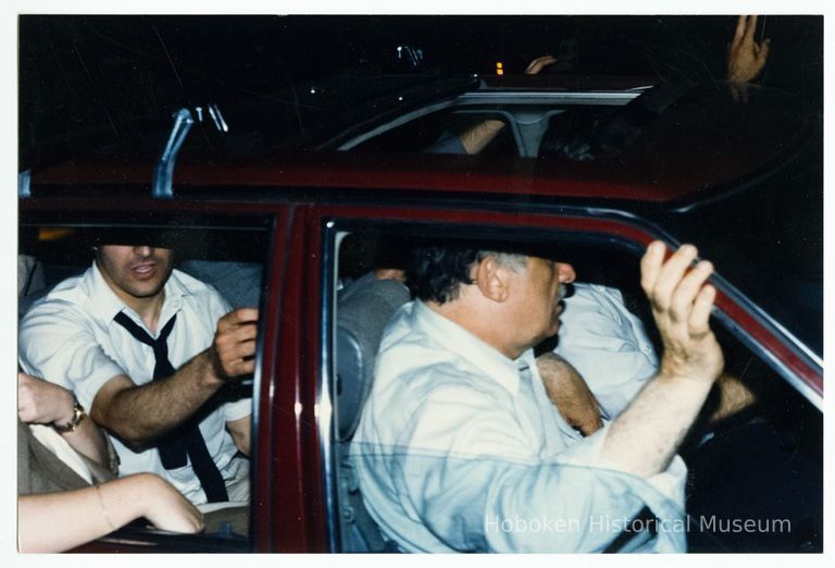 Color photo of mayoral candidate Tom Vezzetti in front seat of car on election night, Hoboken, [June 11, 1985]. picture number 1