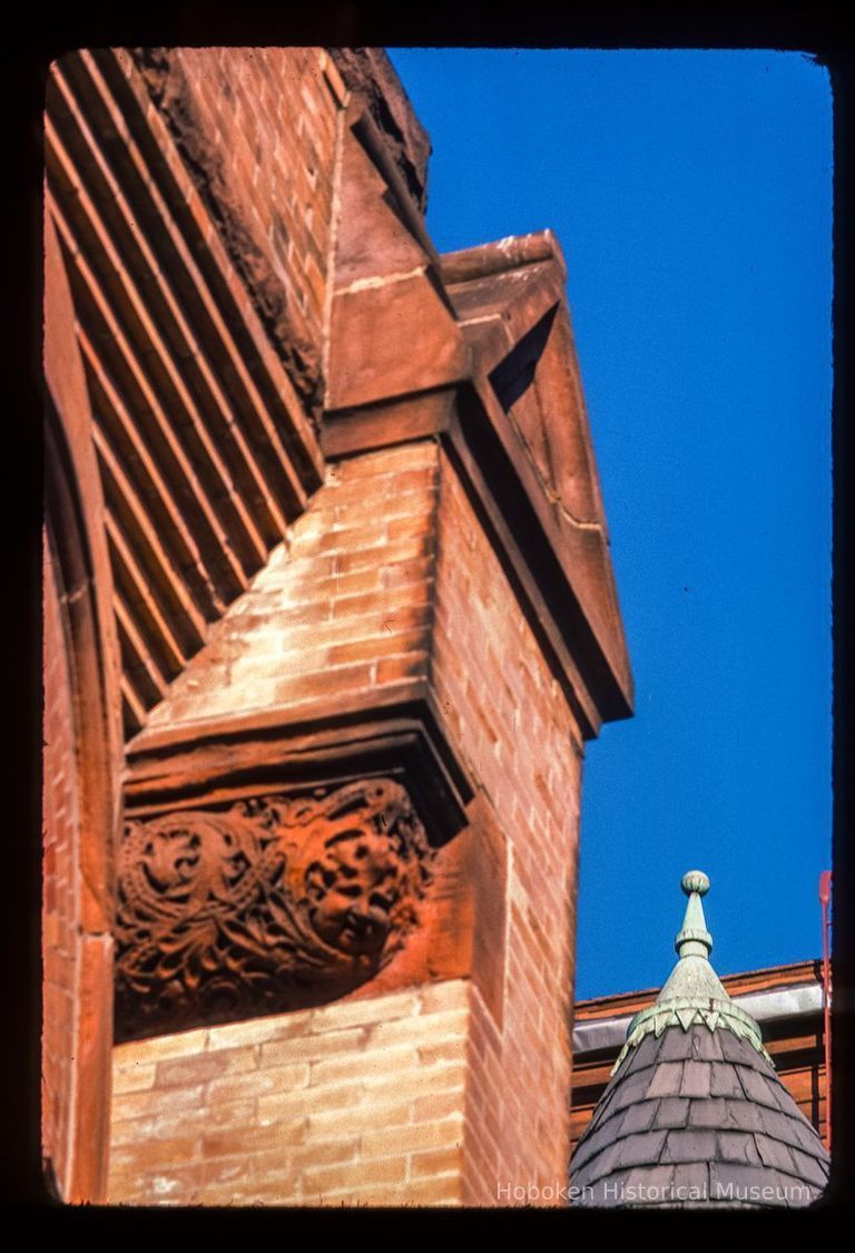 Color slide of detail view of brick pediment and turret on the First Baptist Church at 901 Bloomfield on the corner of Bloomfield and 9th picture number 1