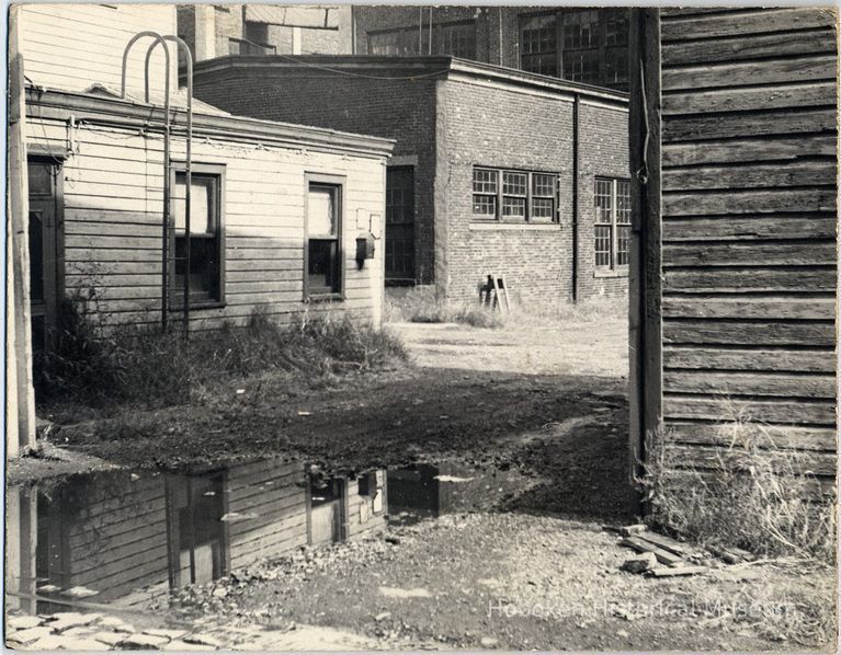 B+W photo of the rear exterior of waterfront buildings just south of the Maxwell House Coffee plant, Hoboken, 1972. picture number 1