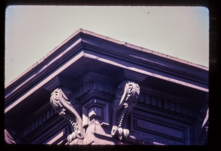 Color slide of detail view of cornice, brackets, dentils and frieze at 901 Garden on the NE corner with 9th picture number 1